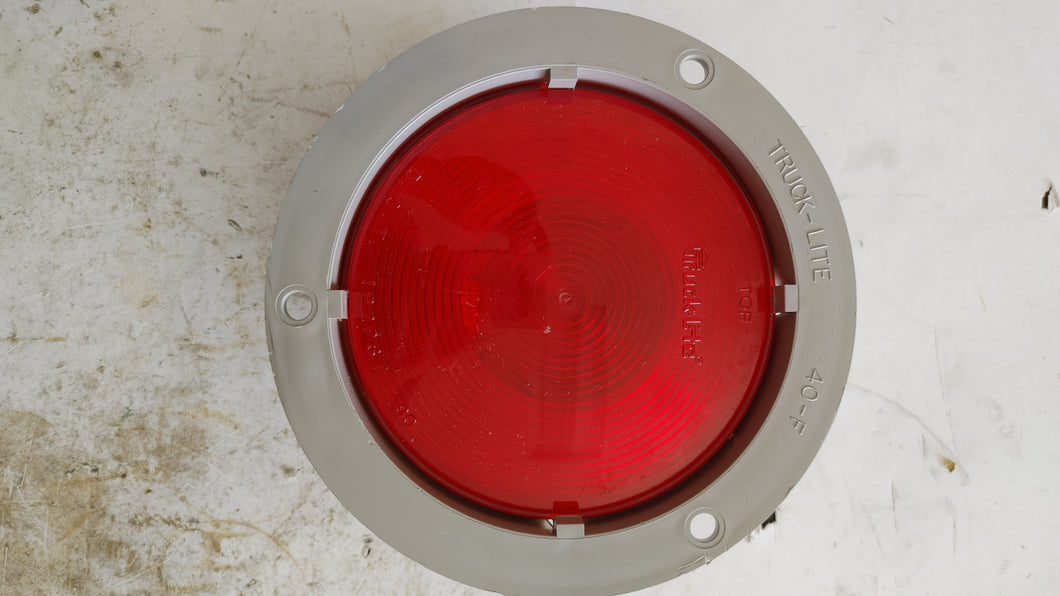 40229R3 - Truck-Lite - Red Round Tail Light40 Economy, Incandescent, Red, Round, 1 Bulb, Stop/Turn/Tail, Red Flange Mount, PL-3, 12V, Bulk